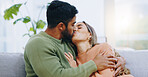 Love, hug and couple kissing on a sofa with romance, bond and intimacy at home together. Passion, desire and people embrace in a living room with romance, moment or soulmate connection in a house