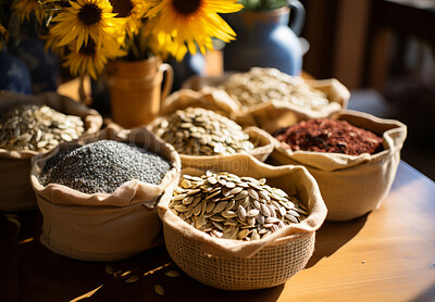 Closeup, seeds and sunflower on table from farming, agriculture and environment harvest. Organic food, plantation and nutritious produce in bags for service industry, agribusiness and sustainability