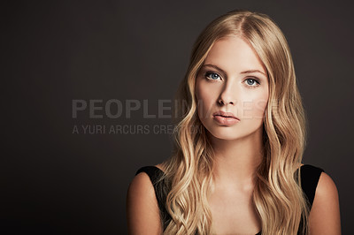 Buy stock photo Portrait, face and beauty of a woman with makeup, cosmetics and hair shine in studio. Headshot of a female aesthetic model with skin glow, luxury skincare and mockup space on a dark background
