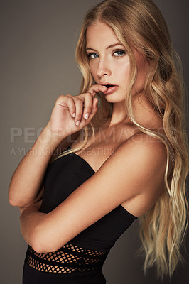 Buy stock photo Face, beauty and portrait of a seductive woman in studio with makeup, cosmetics and long hair. Headshot of female aesthetic model with natural glow, luxury skincare and sexy pose on a grey background