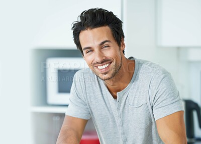 Buy stock photo Cropped portrait of a handsome young man in his kitchen