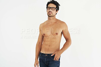 Buy stock photo Portrait, shirtless and glasses with a sexy man model in studio on a white background for masculine desire. Body, tattoo and manly with a handsome young male nerd posing topless for rugged sensuality