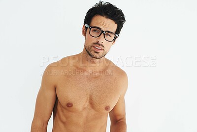 Buy stock photo Portrait, topless and glasses with a sexy man model in studio on a white background for masculine strength. Body, tattoo and a handsome young male nerd posing shirtless for muscular confidence