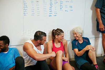 Buy stock photo Shot of a group of people chilling at the gym after a workout