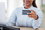 Woman, hand and credit card by laptop, office and typing with click, easy payment and online shopping. Employee, person or girl with banking, computer and e commerce with finance, choice or budget