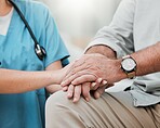 Nurse holding hands with old man in hospital consulting after surgery or medical test results for support. Empathy, healthcare clinic or doctor working or helping a depressed or sick elderly person 
