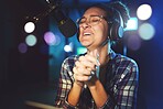 Radio DJ, headphones and microphone, woman is excited with singing or talking, broadcast media and announcement. Female in studio booth, recording and happiness with smile, excitement and carefree