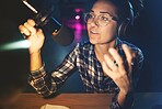 Podcast, microphone and live streaming woman speaking, advice or broadcast on gen z platform at night. Serious influencer person with voice talking on mic for news, politics or media report on radio