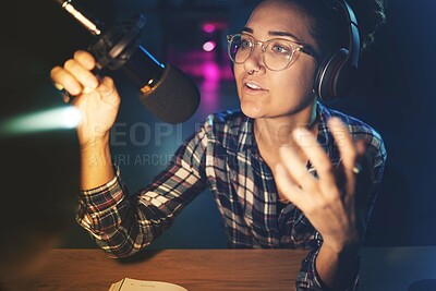 Buy stock photo Podcast, microphone and live streaming woman speaking, advice or broadcast on gen z platform at night. Serious influencer person with voice talking on mic for news, politics or media report on radio