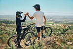 Fist bump, teamwork and cycling with friends on mountain bike for motivation, extreme sports and adventure. Fitness, workout and bonding with men in nature for adrenaline junkie, freedom and travel