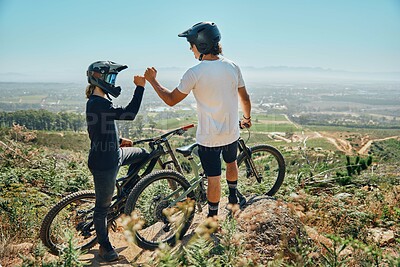 Buy stock photo Fist bump, teamwork and cycling with friends on mountain bike for motivation, extreme sports and adventure. Fitness, workout and bonding with men in nature for adrenaline junkie, freedom and travel