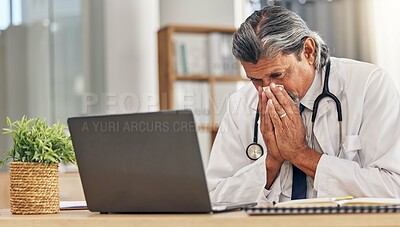 Buy stock photo Sneezing, sick and a doctor with a laptop in an office, blowing nose and an allergy at a hospital. Healthcare, medicine and a mature medical employee with a tissue with covid or a virus at work