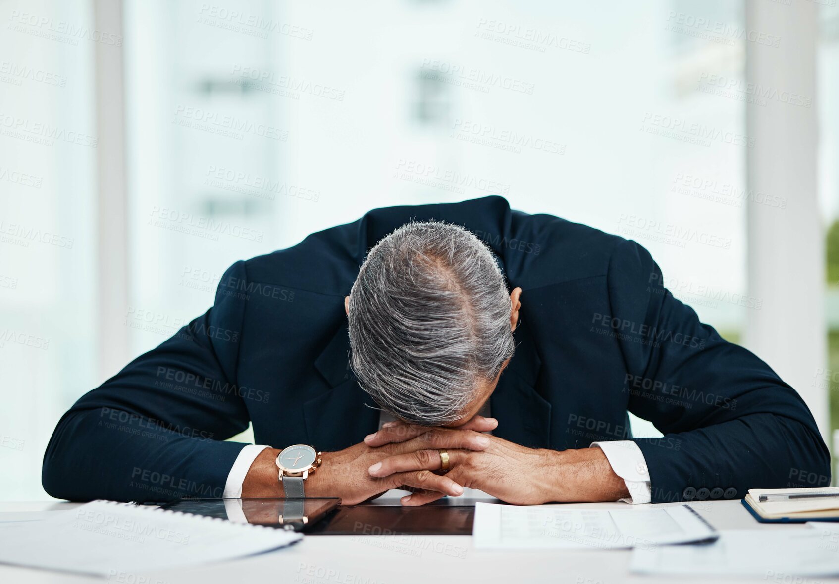 Buy stock photo Burnout, professional and senior man sleeping at desk with tech or problem with fatigue in office. Tired, stress and senior male person asleep on table with insomnia at workplace at workplace.