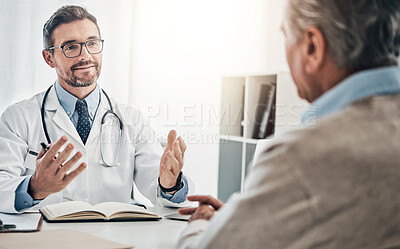 Buy stock photo Shot of a friendly doctor consulting with a mature patient in his office