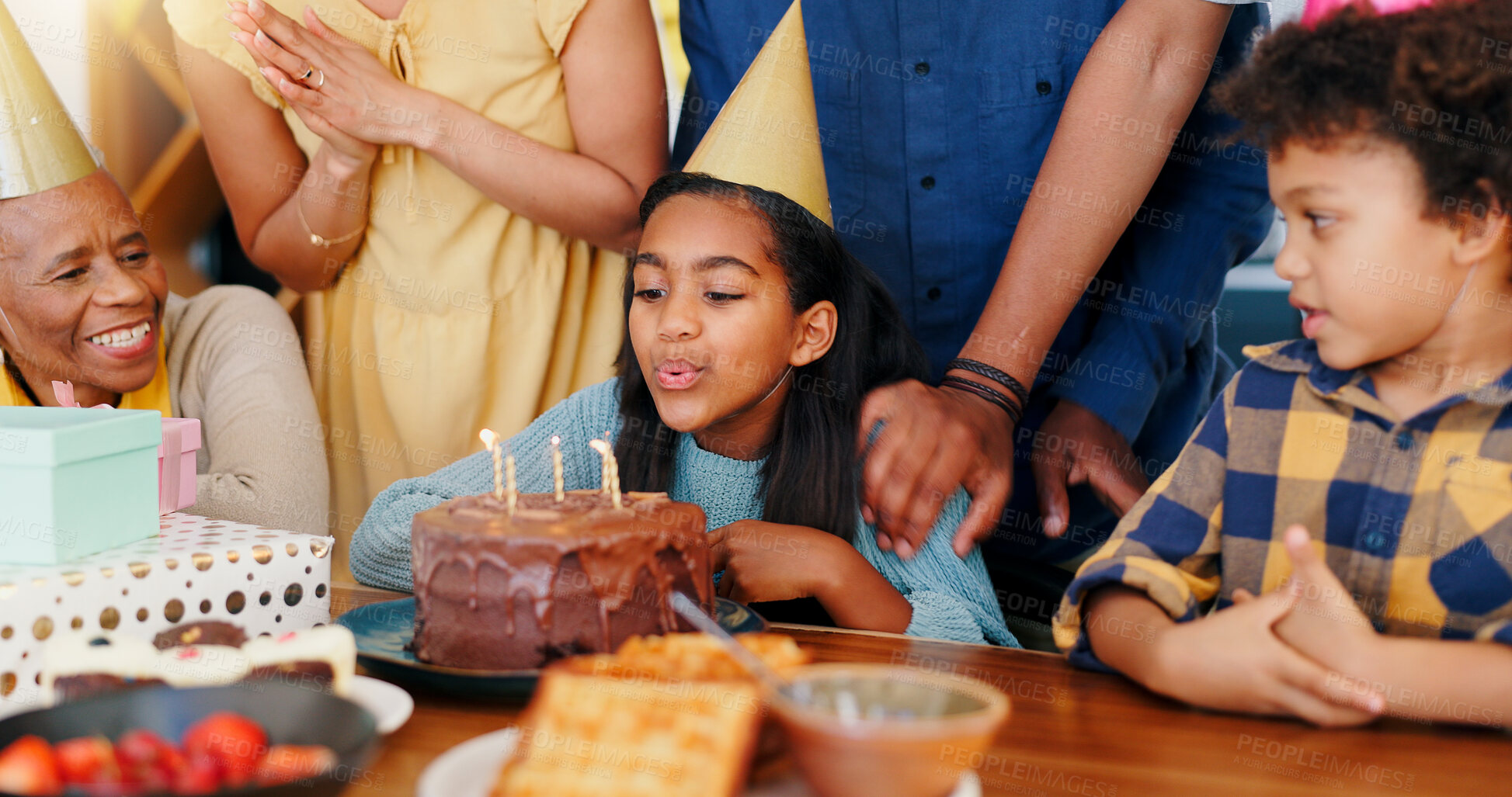 Buy stock photo Happy birthday, wish and cake in celebration for party, holiday or special day with family at home. Excited little girl or child blowing candles in growth, love or care for event, bonding at house