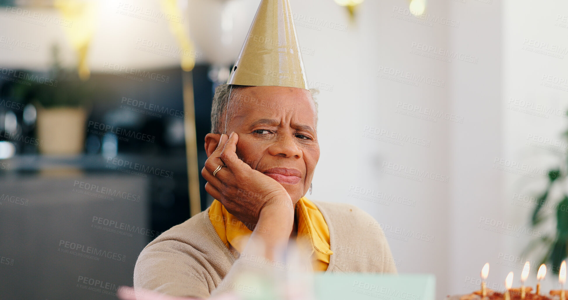 Buy stock photo Sad, birthday and portrait of senior woman with depression, grief and lonely in her home. Cake, face and elderly African person alone at a party with disappointment, frustrated or annoyed in a house