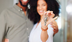 Couple, hand and keys at front door, new home and portrait with pride, care and bonding. African woman, man and happy together with embrace, love and investment with property, real estate or house