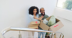 Real estate, box and vision with a black couple moving house for growth, investment or mortgage. Property, smile or happy with a man and woman on stairs in their new home together for future planning