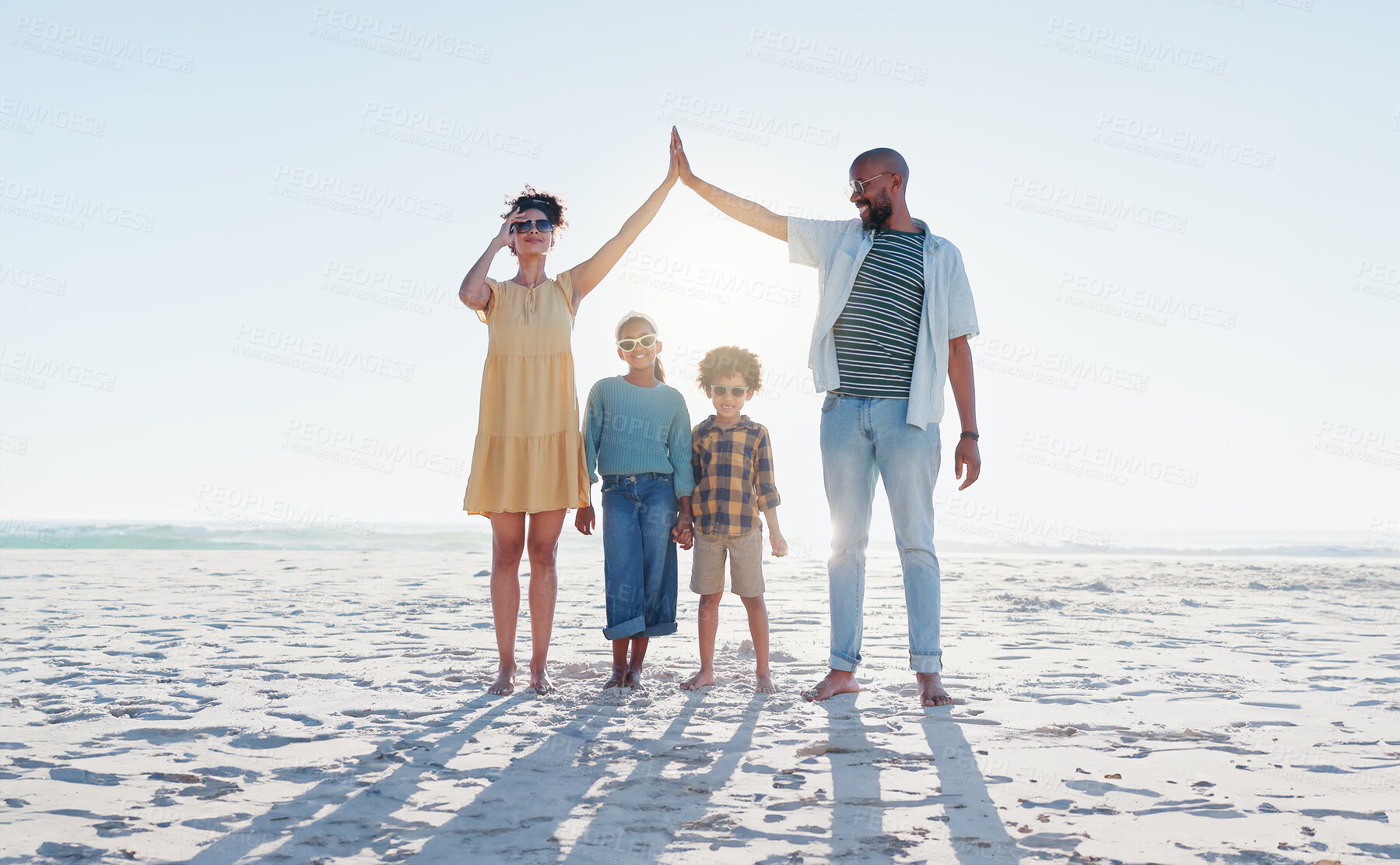 Buy stock photo Insurance, hands and a family on the beach for protection, security or travel together. Sunglasses, safety or mockup with a mom, dad and children on the sand by the ocean or sea for love and trust