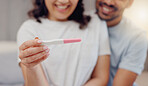 Excited couple, hands and positive pregnancy test for maternity, start or family at home. Closeup of happy man and pregnant woman smile for parenthood, morning or good news or results in bedroom