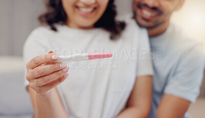 Buy stock photo Excited couple, hands and positive pregnancy test for maternity, start or family at home. Closeup of happy man and pregnant woman smile for parenthood, morning or good news or results in bedroom