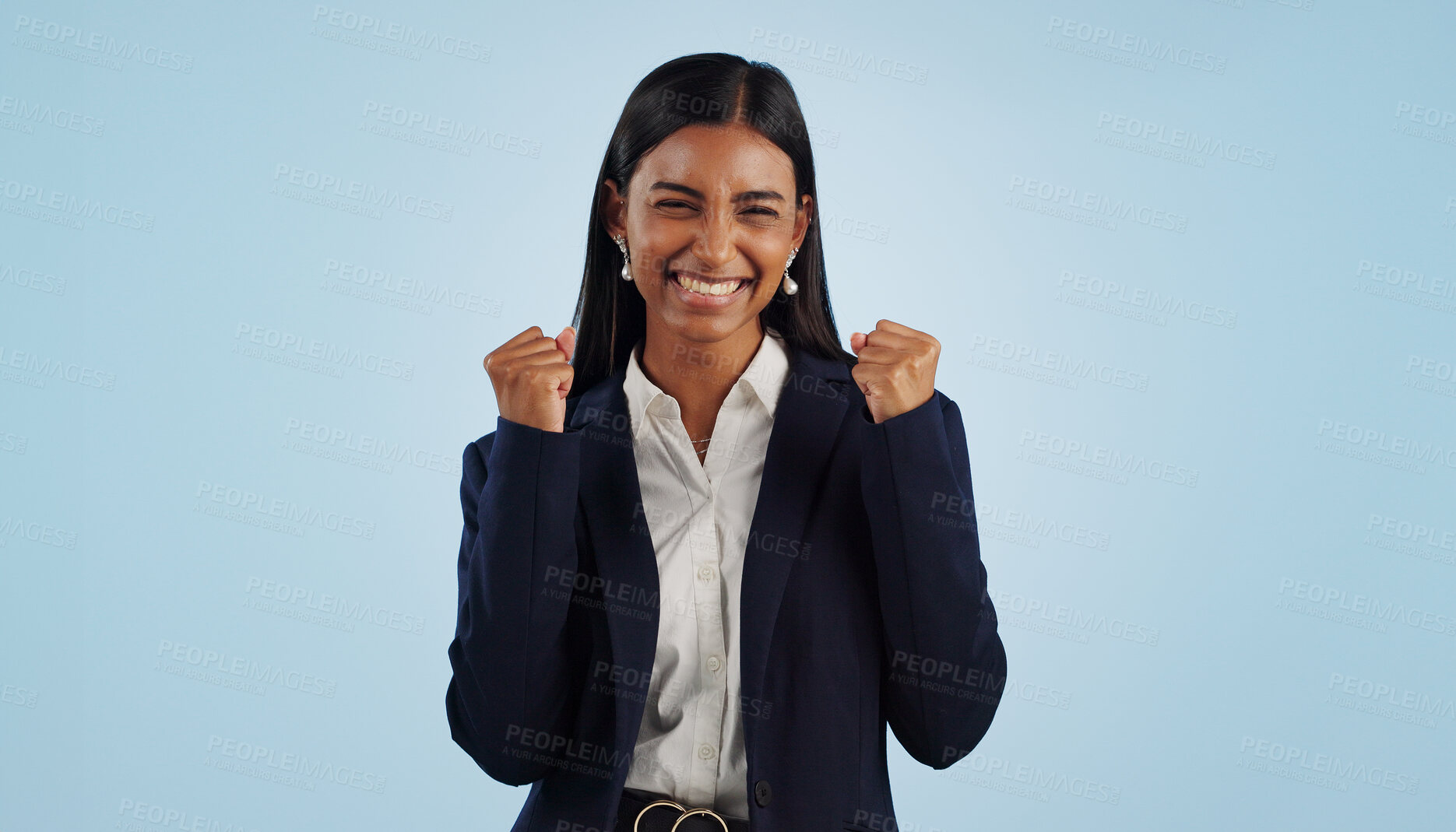 Buy stock photo Winner, excited or happy woman in celebration for a business deal isolated on blue background. Wow, goals or proud Indian lady with smile, victory success or reward in entrepreneurship or studio