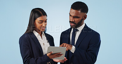 Buy stock photo Collaboration, tablet and a corporate business team in studio on a blue background for problem solving. Technology, data or feedback with a professional man and woman talking about information