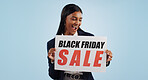 Business woman, sale and sign for discount, advertising or deal against a blue studio background. Shocked female person with billboard, poster or wow for marketing, promotion or Black Friday special