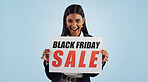 Happy woman, portrait and sale sign for discount, advertising or deal against a blue studio background. Female person and billboard, poster or marketing in promotion or Black Friday special on mockup