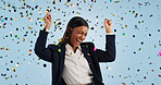 Happy business woman, confetti and celebration for winning or promotion against a blue studio background. Excited female person or employee smile in freedom for victory, achievement or party event