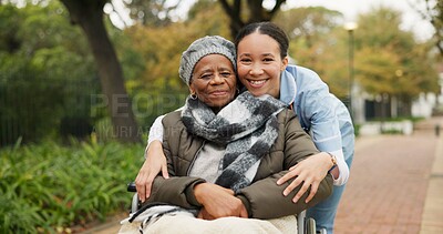 Nurse, hug and park with old woman in a wheelchair for retirement, elderly care and physical therapy. Trust, medical and healthcare with portrait of patient and caregiver in nature for rehabilitation