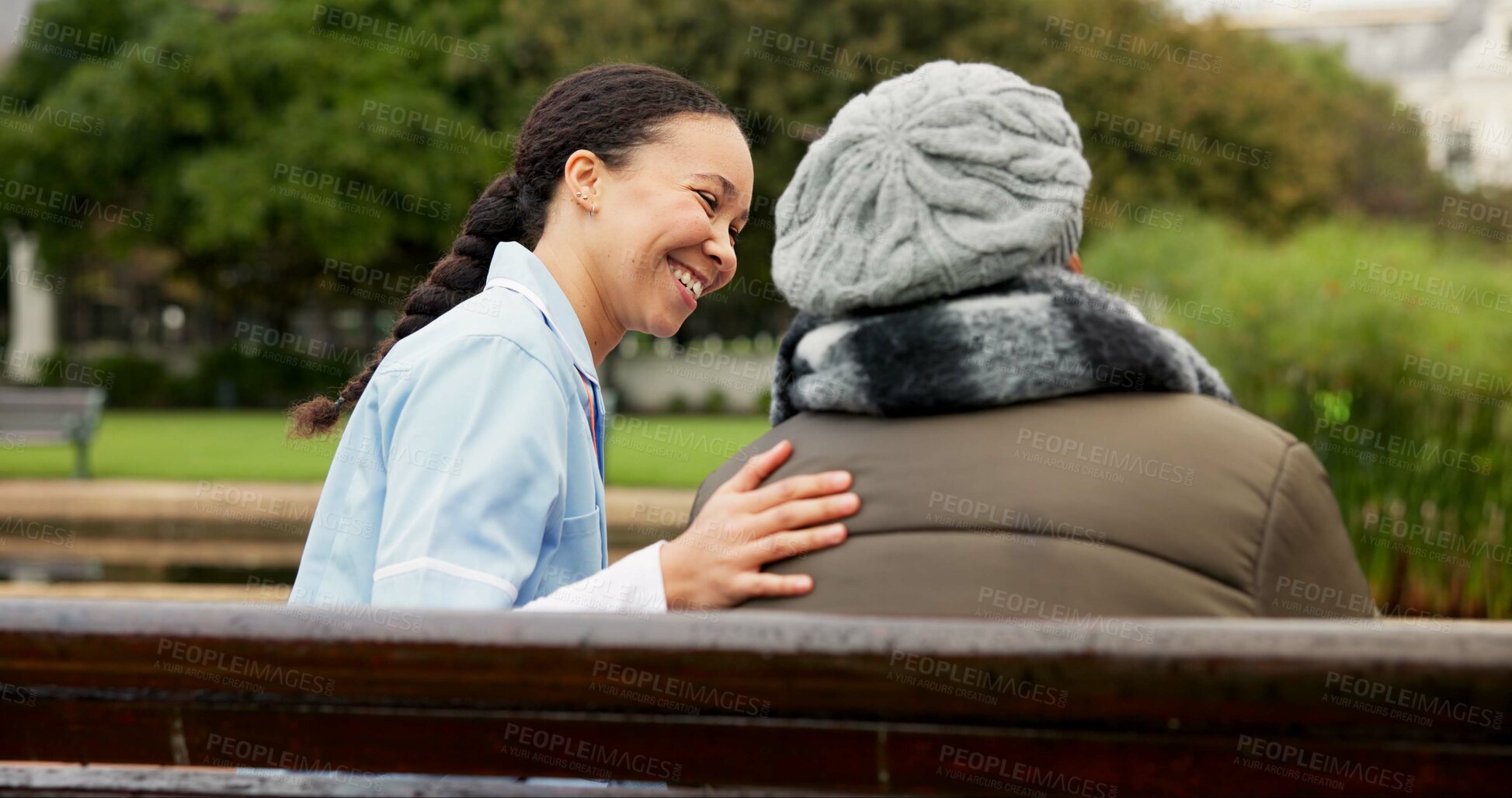 Buy stock photo Nurse, happy and support with old woman on park bench for retirement, elderly care and conversation. Trust, medical and healthcare with senior patient and caregiver in nature for rehabilitation