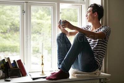 Buy stock photo Man, drinking coffee and thinking by window, peace and growth at home, vision and idea for future. Male person, positive mindset and tea by view, relax and calm or inspiration, planning and daydream