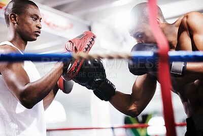 Buy stock photo Man, boxing and personal trainer in ring fight at gym for workout, exercise or indoor self defense training together. Male person, boxer or fighting sparing partner in sports, competition or practice