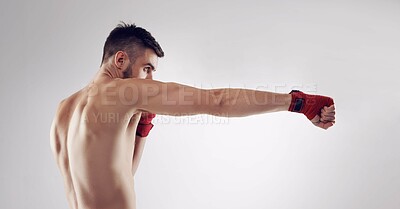 Buy stock photo Shot of an MMA fighter in the studio