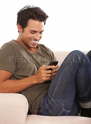 Buy stock photo Man, phone or happy on sofa with relax, communication or conversation for break in living room of home. Person, face or smile with smartphone or technology on couch in lounge for text message or chat