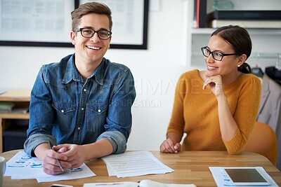 Buy stock photo Portrait of two colleagues working together on a creative project