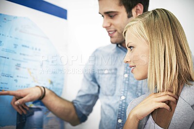 Buy stock photo Travel agency teamwork, map and happy business people, agent or partner pointing at world tour location. Tourism industry advice, workplace collaboration and team working on route journey destination