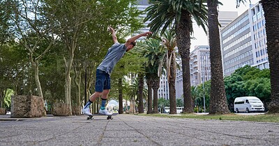 Buy stock photo Shot of skateboarders in the city