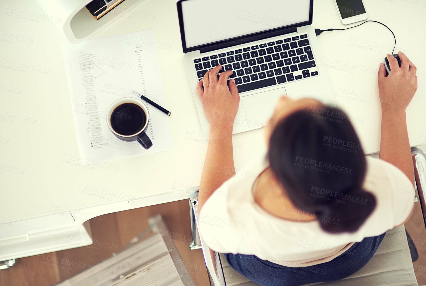 Buy stock photo High angle shot of a young businesswoman working on her laptop at home