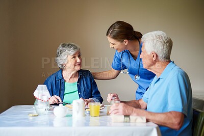 Buy stock photo Shot of two residents and a nurse at a retirement home