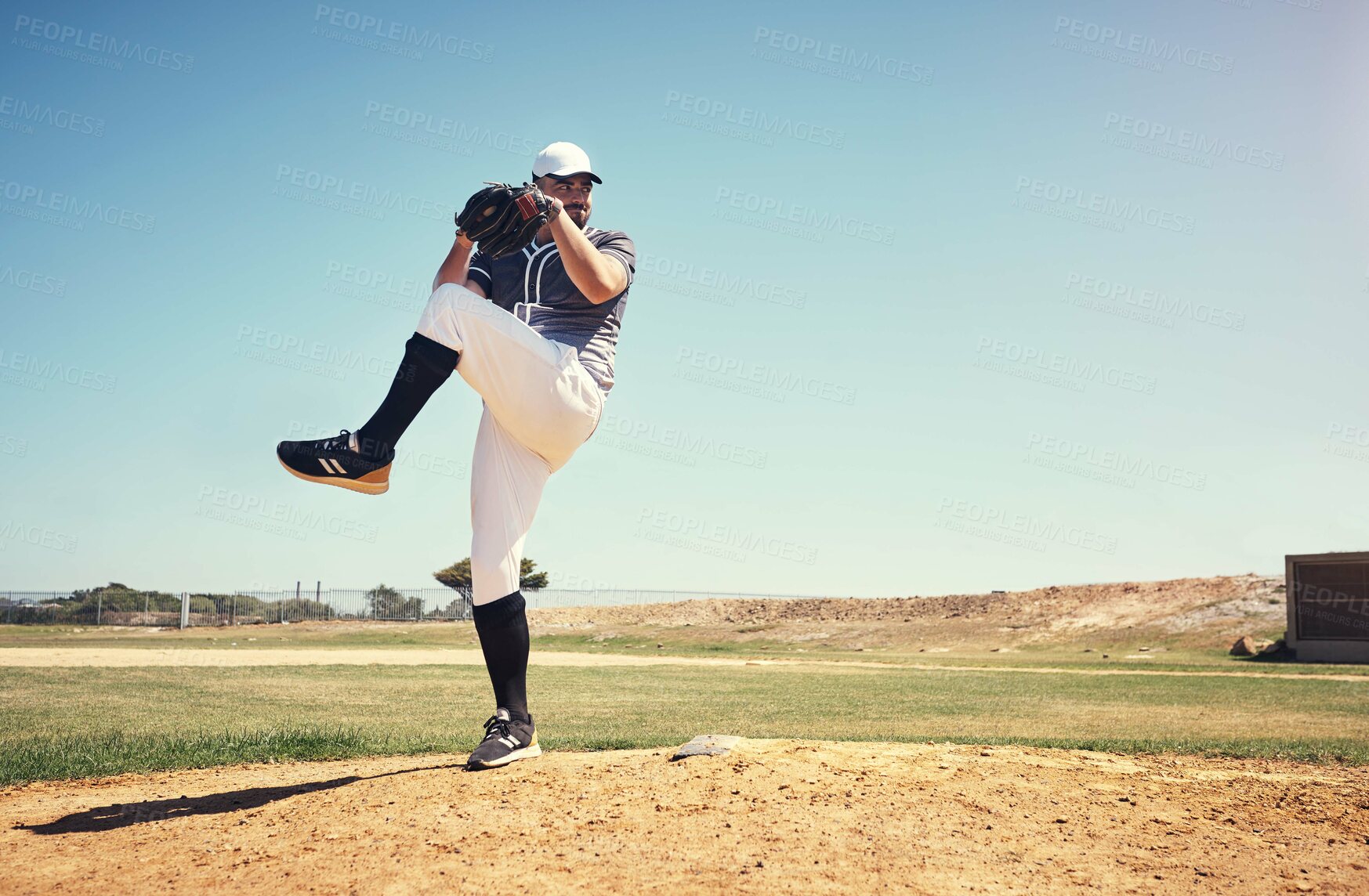 Buy stock photo Pitch, sports and baseball with man on field for competition, training and games. Action, exercise and championship with male athlete throwing in stadium park for fitness, performance and club