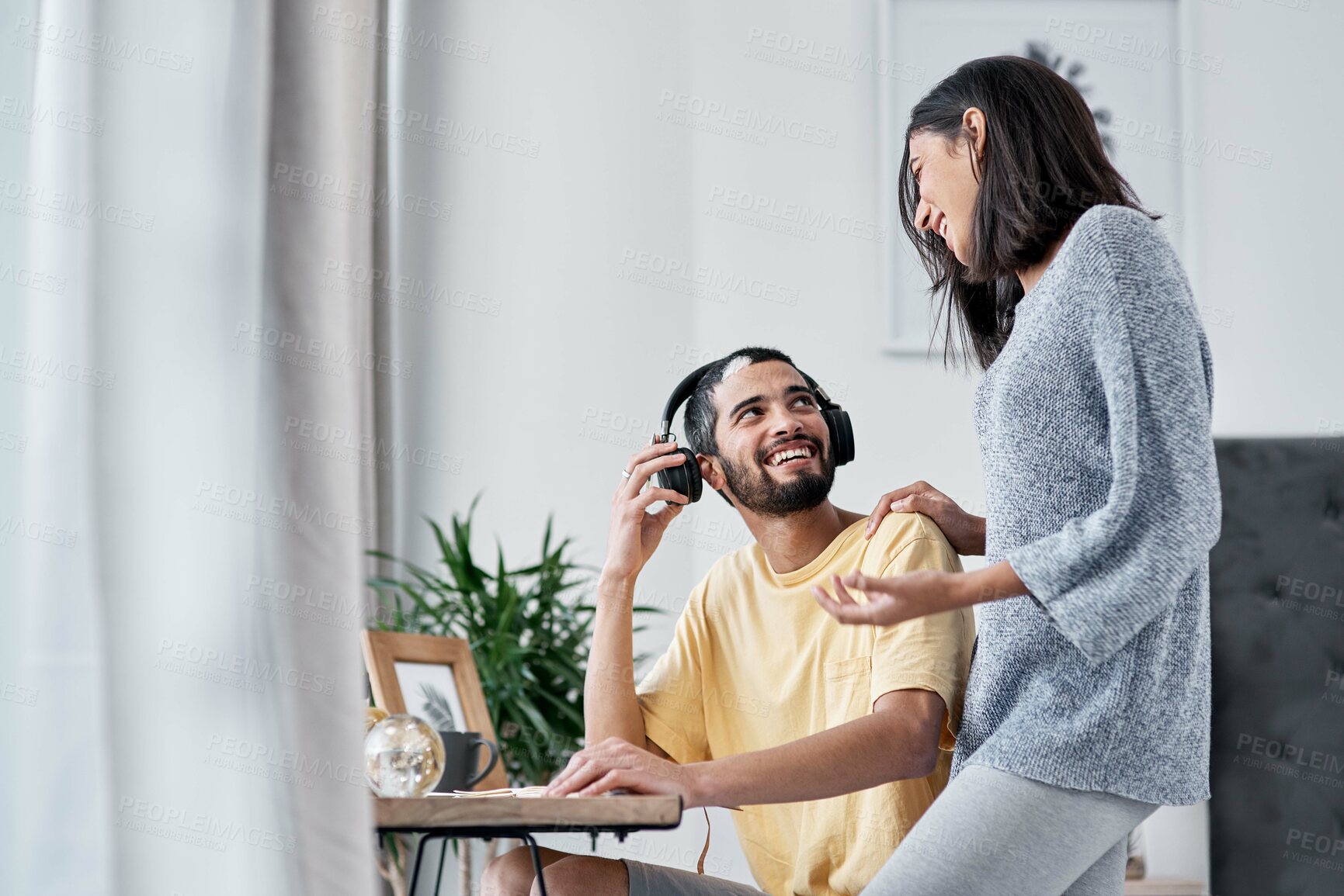 Buy stock photo Shot of a happy young couple working from home