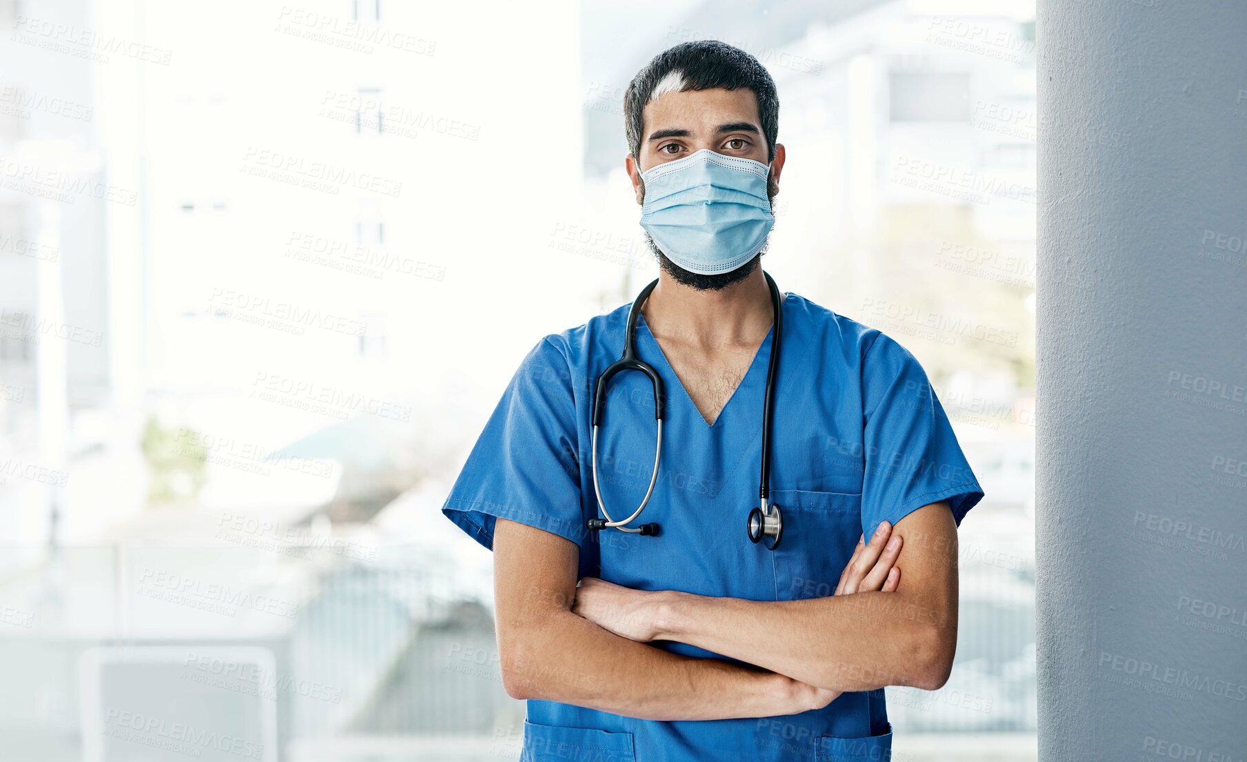 Buy stock photo Portrait of a medical practitioner wearing a face mask in a hospital