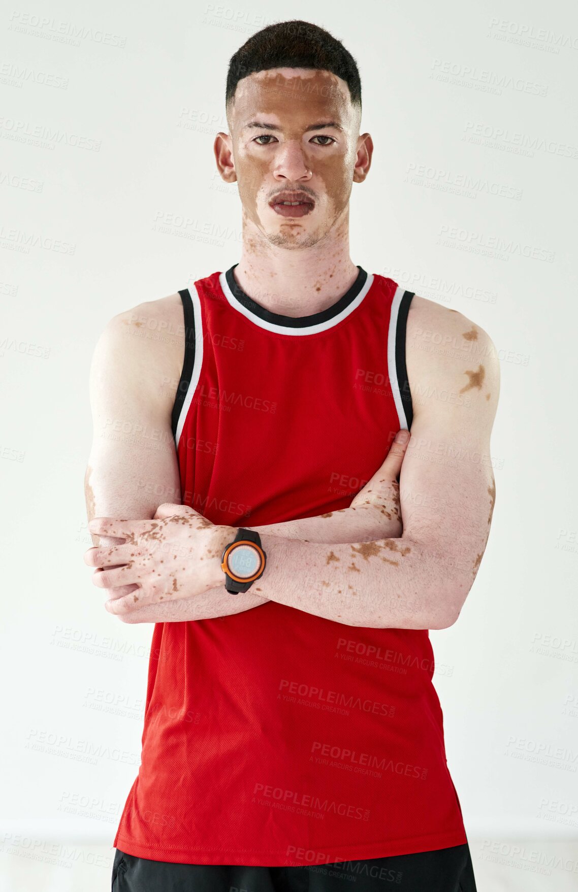 Buy stock photo Cropped portrait of a handsome young male basketball player posing in studio