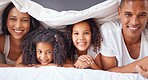 Portrait of happy black family bonding on a bed, relax and smile in a bedroom together. Love, blanket and happiness parents enjoying free time with their children, being playful and love in morning
