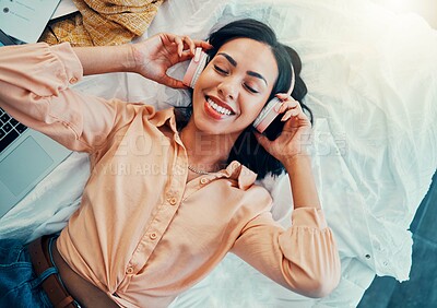 Buy stock photo Woman with headphones, music or podcast, freedom and relax, carefree in her home, happy with technology and audio with top view. Young person, listening and streaming, radio and online subscription.