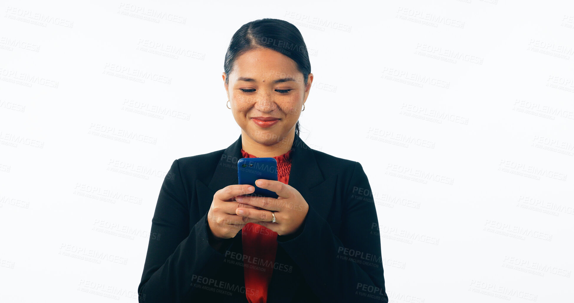 Buy stock photo Asian lawyer woman, phone and studio with smile, reading and texting client with news by white background. Japanese advocate, attorney or corporate legal expert with smartphone, typing and networking