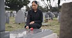 Sad woman, graveyard and rose on tombstone in mourning, loss or grief at funeral or cemetery. Female person with flower in depression, death or goodbye at memorial or burial service for loved one