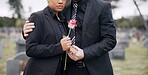 Rose, death or couple in cemetery for funeral. spiritual service or burial to repsect the Christian religion. Mourning, depressed or sad people hug in graveyard for grief, loss or goodbye farewell